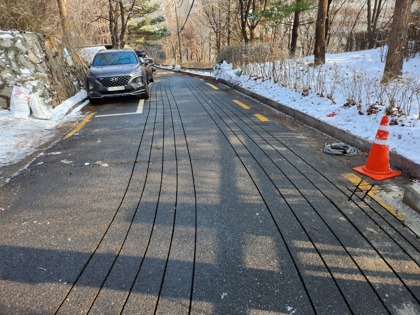 진동 충진 장비를 이용한 도로 결빙방지용 히팅케이블 매설공법